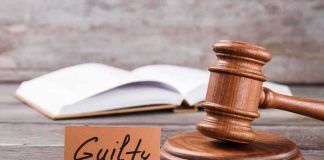 Woman GUILTY — Random Toddler STABBING A wooden gavel next to a card that reads 'Guilty' and an open book