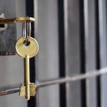 Shock: Maxwell’s Prison Perks Revealed – Unbelievable! Key in lock of prison cell door.