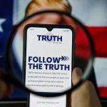 Trump UNLEASHES Thanksgiving Day Political ASSAULT Phone screen displaying Truth Social app magnified