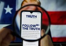 Trump UNLEASHES Thanksgiving Day Political ASSAULT Phone screen displaying Truth Social app magnified
