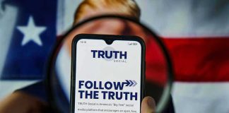 Trump UNLEASHES Thanksgiving Day Political ASSAULT Phone screen displaying Truth Social app magnified