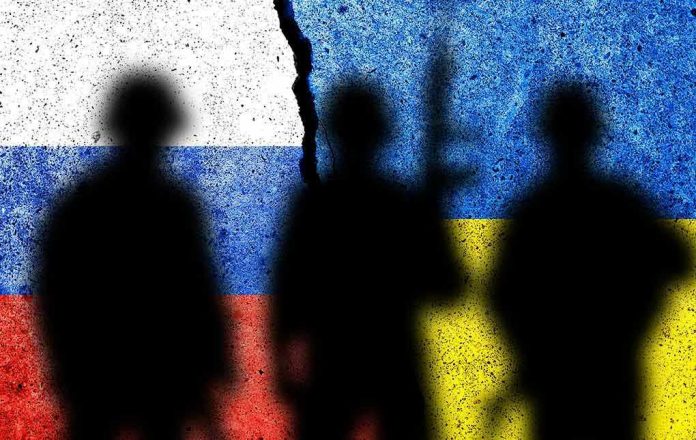 Silhouettes against split Russian and Ukrainian flags.