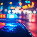 Three Kids MURDERED at Birthday Celebration Police car with flashing lights at night.