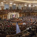 Congressman ARRESTED – Fed Agents Swoop In! Large assembly in a government legislative chamber.