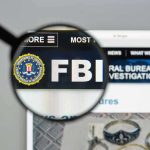 Tucker Carlson SLAMS FBI Over Shooter Cover-Up FBI website shown through magnifying glass.