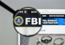 Tucker Carlson SLAMS FBI Over Shooter Cover-Up FBI website shown through magnifying glass.