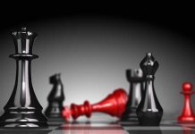 Female Cartel Leader’s Brutal Reign Ends in Juárez Black and red chess pieces on a board.