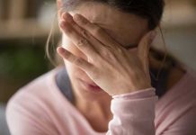 Lawmakers FAIL to Address Mental Health Epidemic Woman covering face with hand looking stressed