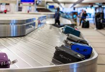 Airport Bomb THREAT – Suspect in Custody Luggage on airport baggage claim conveyor belt.
