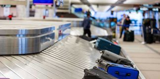 Airport Bomb THREAT – Suspect in Custody Luggage on airport baggage claim conveyor belt.