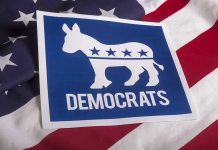 Disgraced Dem Plots Comeback – Outrageous Governor Bid Democrats logo on American flag background