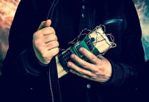 NYE Bombing Plot: Transgender Vet’s Chilling Role Person holding a homemade explosive device.