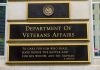 Trump Signs Massive Victory – Veteran’s Compensation SKYROCKETS! Department of Veterans Affairs building sign with quote.