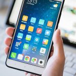 Predator Caught After Dad Tracks Kidnapped Daughter A person holding a smartphone displaying various mobile applications