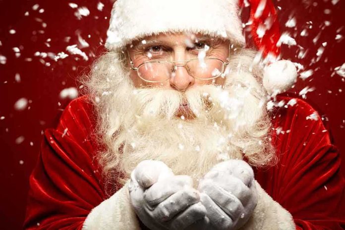 shutterstock_117241135.jpg Santa Claus blowing snowflakes with a joyful expression