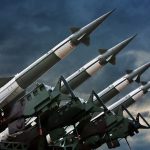 Canada Purchases Weapons STOCKPILE – Washington Stunned! Array of missile launchers positioned against a dramatic sky
