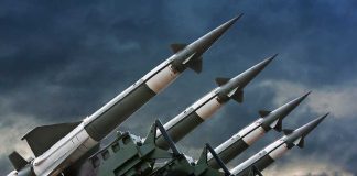 Canada Purchases Weapons STOCKPILE – Washington Stunned! Array of missile launchers positioned against a dramatic sky