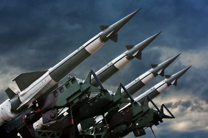 Array of missile launchers positioned against a dramatic sky