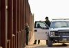 California Congressman Declares WAR On ICE Agents Border patrol agents near a tall metal fence.