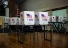 Florida Firestorm Over ‘America Is Full’ Agenda Voting booths set up in a room.