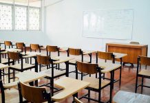 Schools ELIMINATE Gifted Programs—Parents in Panic Empty classroom with desks, chairs, and whiteboard.