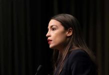 AOC’s Secret 2028 Agenda Exposed! Person speaking at a podium side profile view
