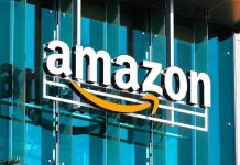 Amazon Drone CRASH Sparks Safety Fears Amazon logo on a glass building facade.