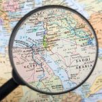 Magnifying glass over the Middle East and Egypt.