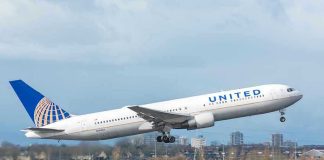 United airplane taking off from a runway.