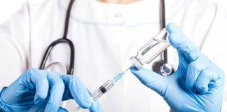 Revealed: Matthew Perry’s $55K Ketamine Addiction Shock Doctor filling syringe with vaccine from vial.