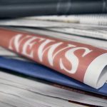 Explosive Claims: Media Fueling Violence Against Trump Stack of newspapers with NEWS headline visible.