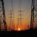 Transmission towers at sunset.