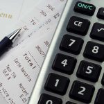 Receipt Exposes Chilling Illinois Murder Plot Calculator, pen, and restaurant receipts on a table