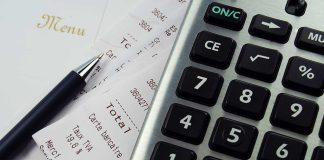 Receipt Exposes Chilling Illinois Murder Plot Calculator, pen, and restaurant receipts on a table