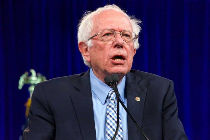 1486814015 Man speaking at podium with blue curtain background.