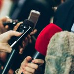 Situation Room Tapes? Reporters Under Fire Interview microphones pointed at a person in suit.