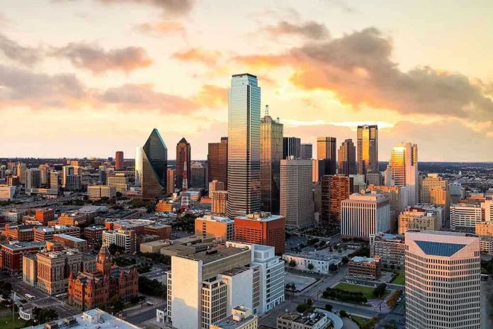 City skyline at sunset with modern skyscrapers.