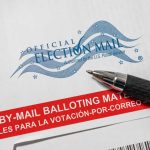 Mail-in ballot envelope with pen