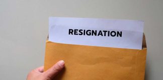 Vanity Fair Grenade Upends West Wing A hand holding an envelope with a resignation letter partially visible