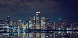 Bears Bolt? Illinois Just Got Humiliated Nighttime view of a city skyline with reflections on water