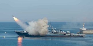 Ceasefire Obliterated: What Did Iran Really Hit? Warship firing missile in the sea.