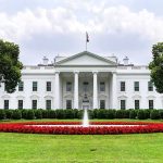 Tuesday Showdown: Trump, Netanyahu, High Stakes The White House with fountain and red flower bed