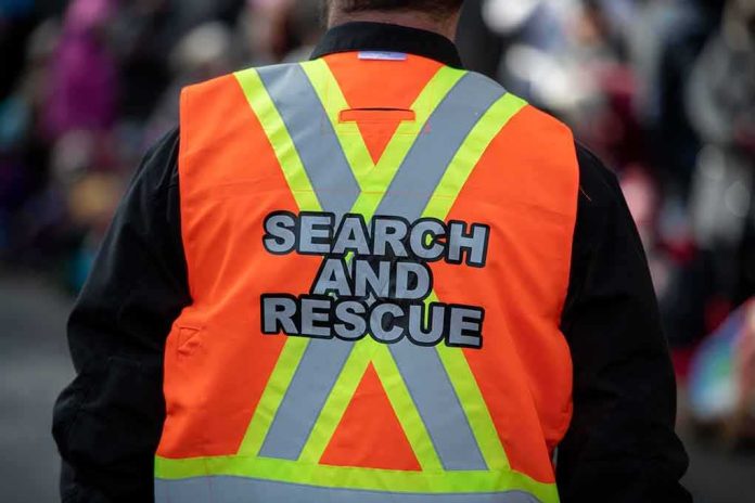 Search and rescue worker in orange reflective vest