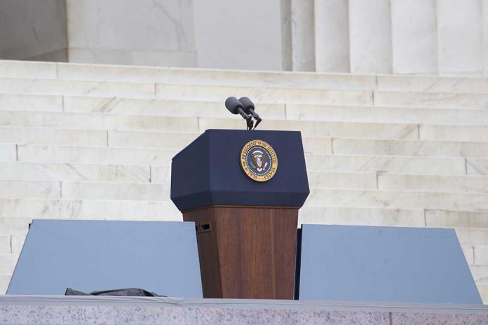 shutterstock_165892070 Podium with a microphone and presidential seal in front of steps