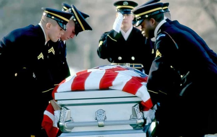 shutterstock_1696761889 Honor guard carrying a flag-draped casket