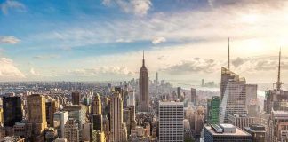 New York’s $10B Income Vanish Aerial view of New York City skyline featuring the Empire State Building at sunset