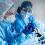 Mifepristone In Water? Study Sparks Uproar Scientists in protective gear working with a syringe in a laboratory