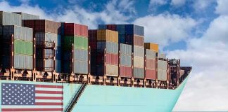Major Military Punishment Looms In Red Sea Cargo ship bow loaded with stacked containers at sea