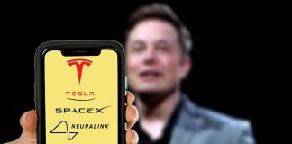 smartphone showing multiple tech company logos with blurred speaker in background