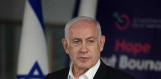 Crown Prince Pitch Sparks Iranian Fury A political leader speaking at a press conference with the Israeli flag in the background